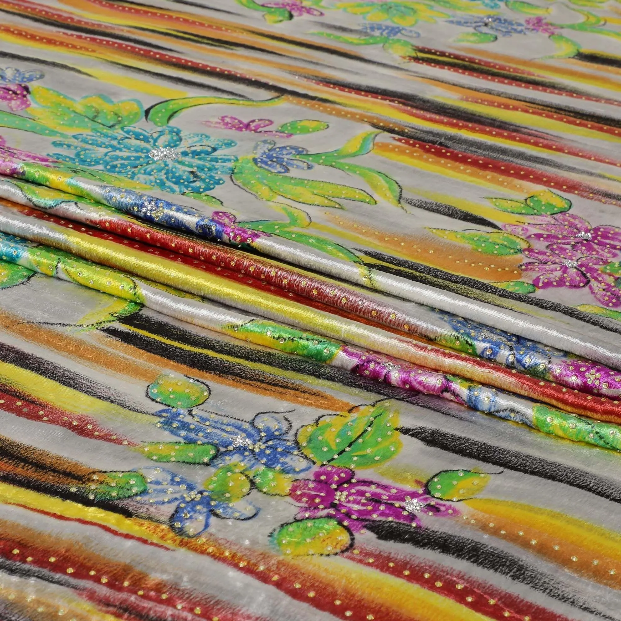 Cloudy Grey Rayon velvet fabric with multicolor stroke print having white and yellow stones in floral design